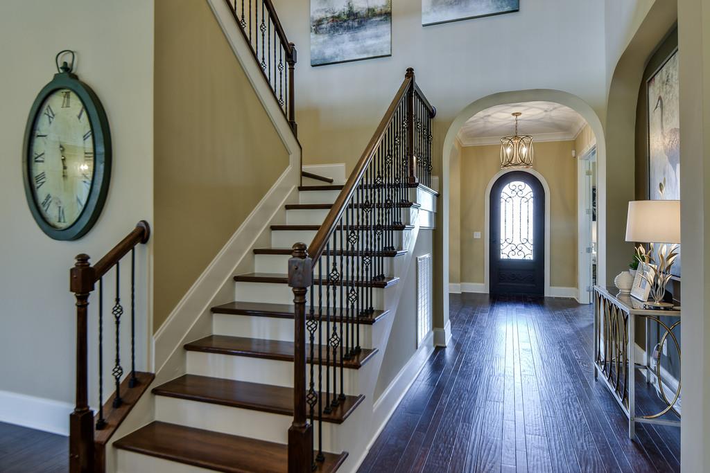 Beautiful stairwell with entry of home ahead