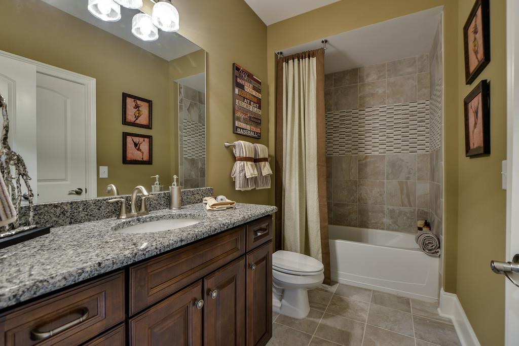 776 Newberry Road Nashville, TN 37205 - Photo 23 of 26 Another secondary bath upstairs. Beautiful tiles and granite has been selected for this home