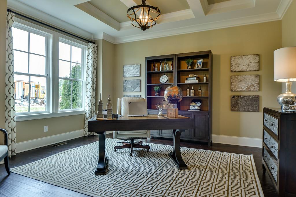 Study is to your left as you enter the home. Coffered ceilings are included in this home