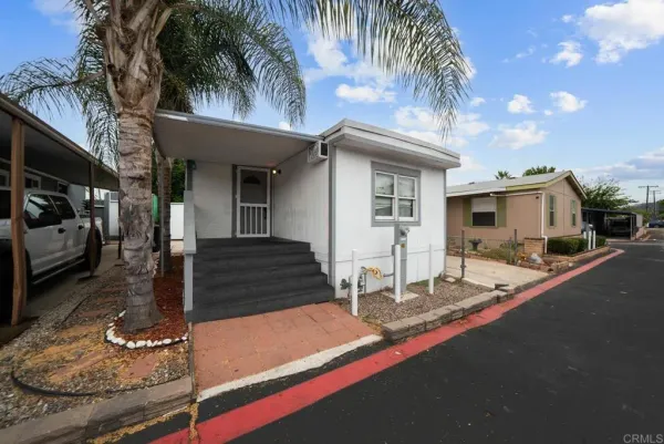 a front view of a house with yard