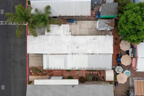 an aerial view of a house with a yard and a fountain