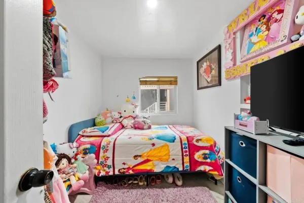 a bedroom with toys and a bed