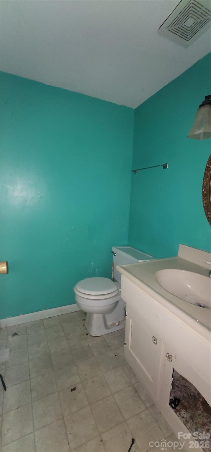 7882 Kinglet Road Connelly Springs, NC 28612 - Photo 17 of 40 a bathroom with a toilet and a sink