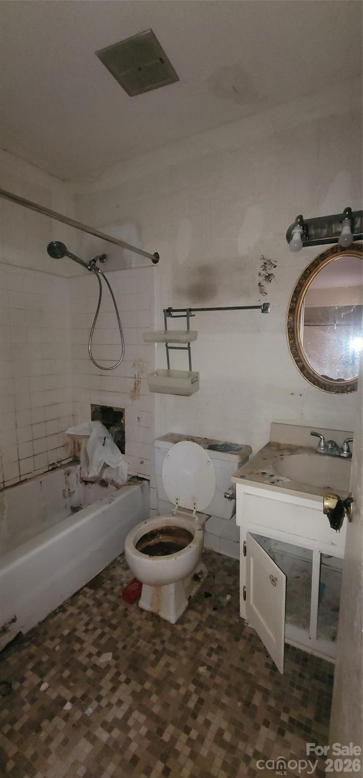 7882 Kinglet Road Connelly Springs, NC 28612 - Photo 22 of 40 a bathroom with a sink toilet and shower