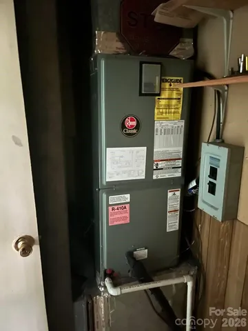 a kitchen with a stove sink and cabinets