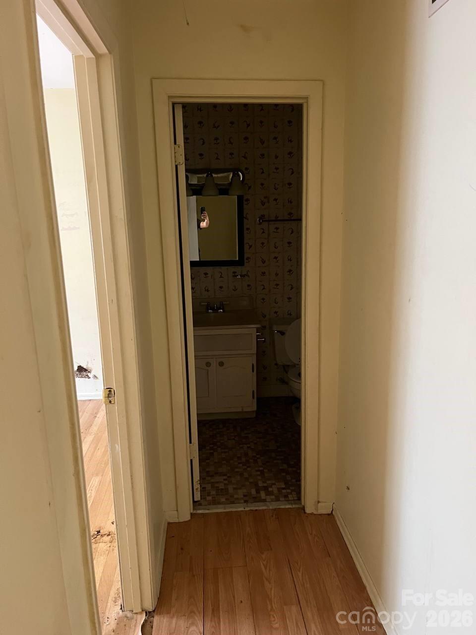 7882 Kinglet Road Connelly Springs, NC 28612 - Photo 5 of 40 a view of a hallway with wooden floor and a hallway