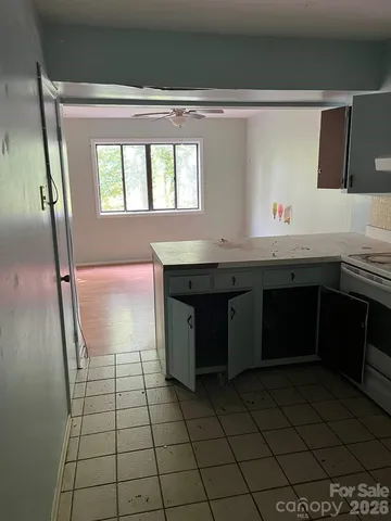 an empty room with wooden floor and closet