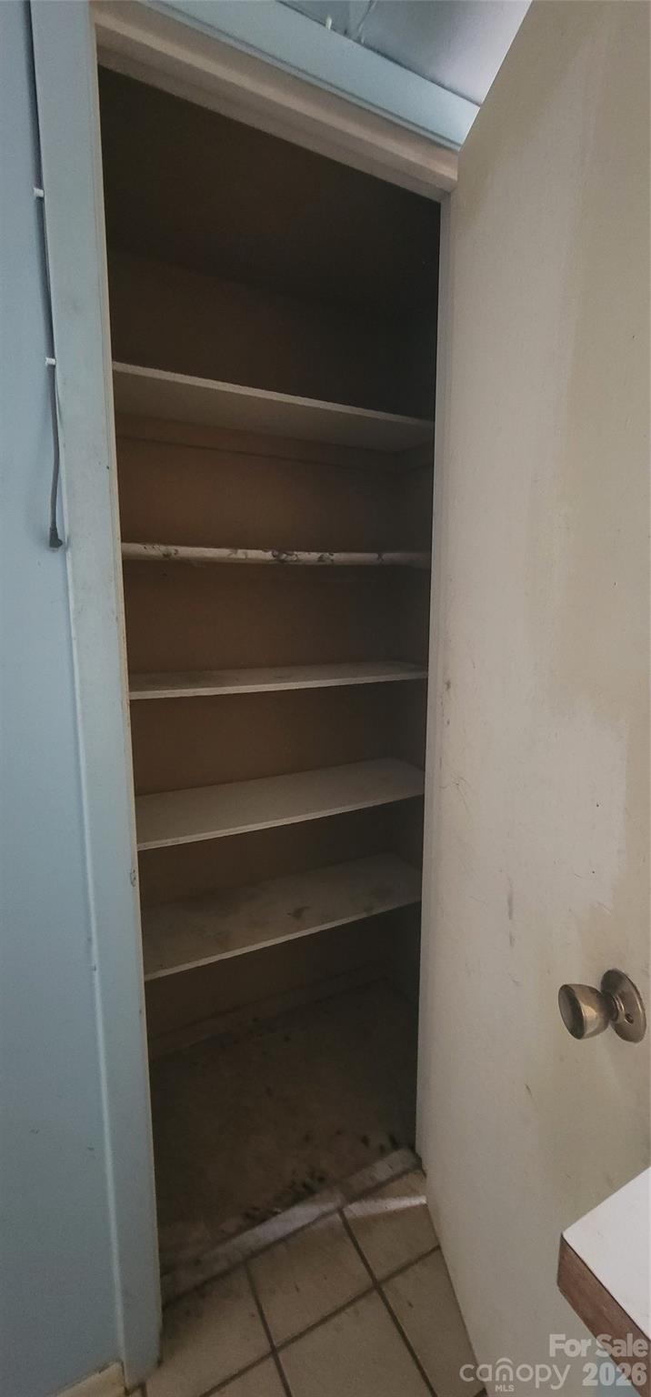 7882 Kinglet Road Connelly Springs, NC 28612 - Photo 10 of 40 a view of walk in closet with empty racks