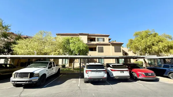 a house view with a car parked