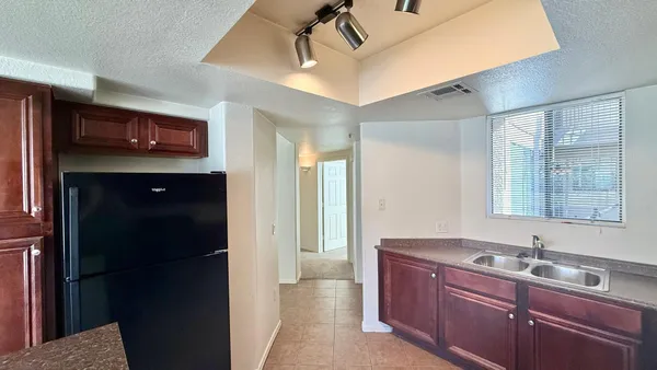 a bathroom with a sink a shower a mirror and a bathtub