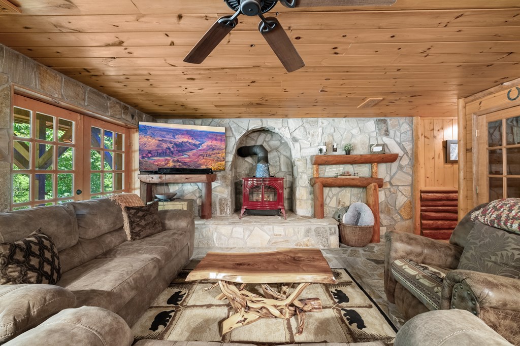 209 Stavanger Road Morganton, GA 30560 - Photo 22 of 39 a living room with furniture and a fireplace