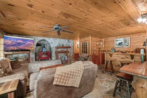 a view of a livingroom with furniture and a flat screen tv