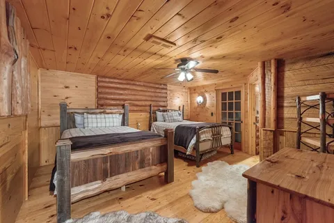 a bedroom with furniture and a chandelier