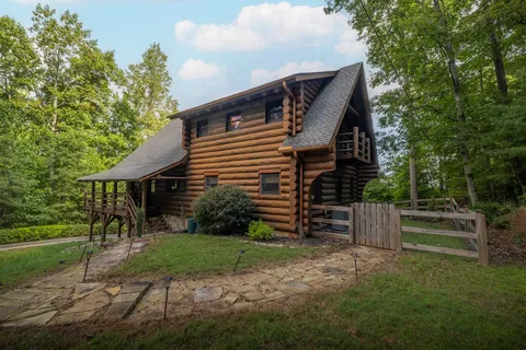 a pathway of a house with a yard