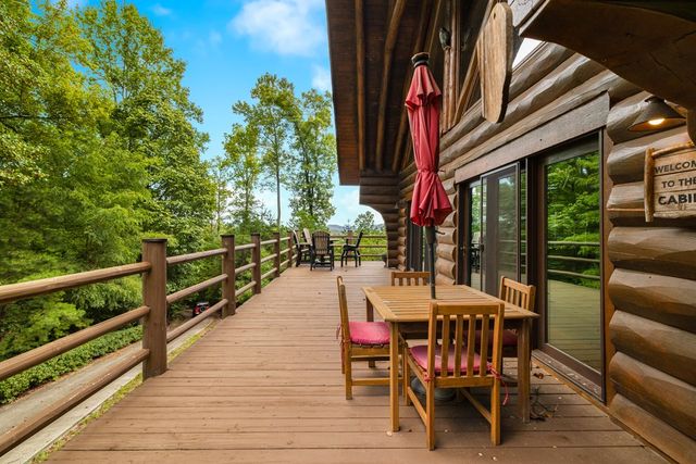 a view of a chairs and tables in the balcony