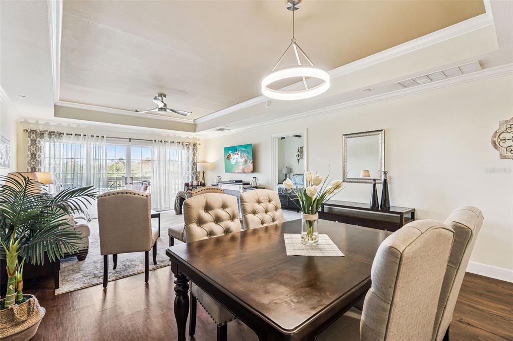 1356 Centre Ct Ridge Drive, Unit 202 Reunion, FL 34747 - Photo 12 of 67 a view of a dining room with furniture and wooden floor