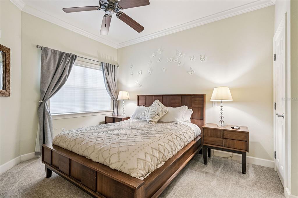 1356 Centre Ct Ridge Drive, Unit 202 Reunion, FL 34747 - Photo 25 of 67 a bedroom with a bed and window