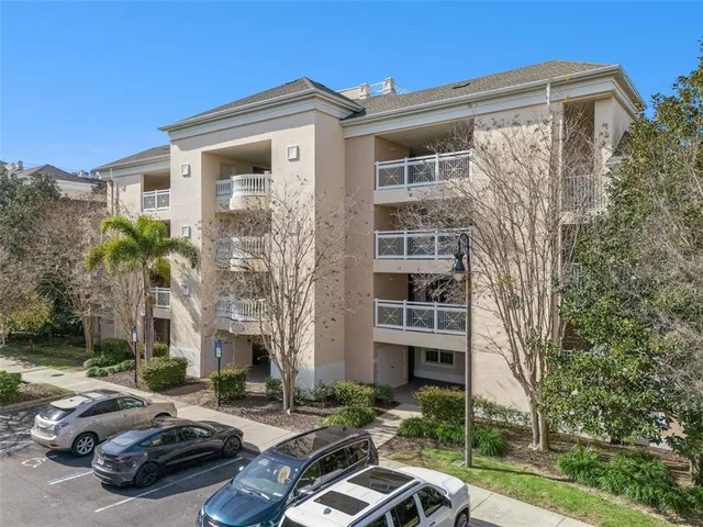 a dining room with furniture a rug and wooden floor