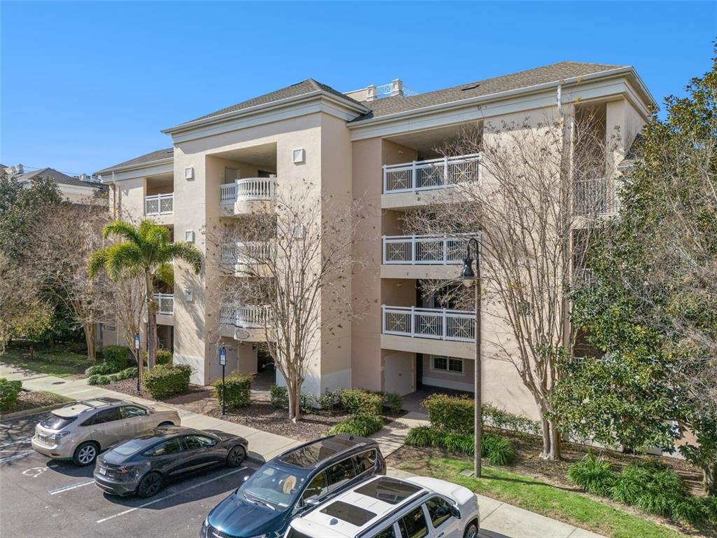 1356 Centre Ct Ridge Drive, Unit 202 Reunion, FL 34747 - Photo 44 of 67 a car parked in front of a house