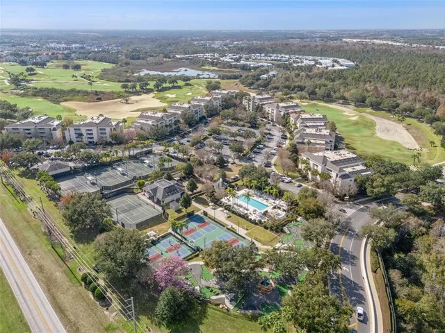 a front view of a house with a yard and a garage