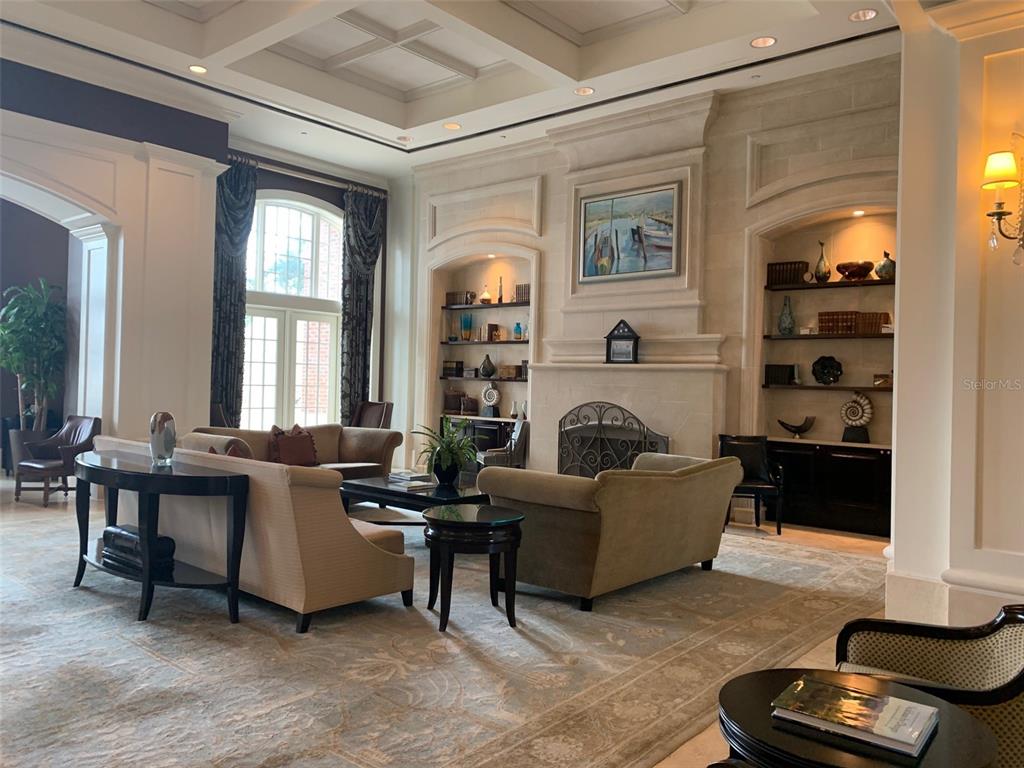 1356 Centre Ct Ridge Drive, Unit 202 Reunion, FL 34747 - Photo 57 of 67 a living room with furniture and a fireplace