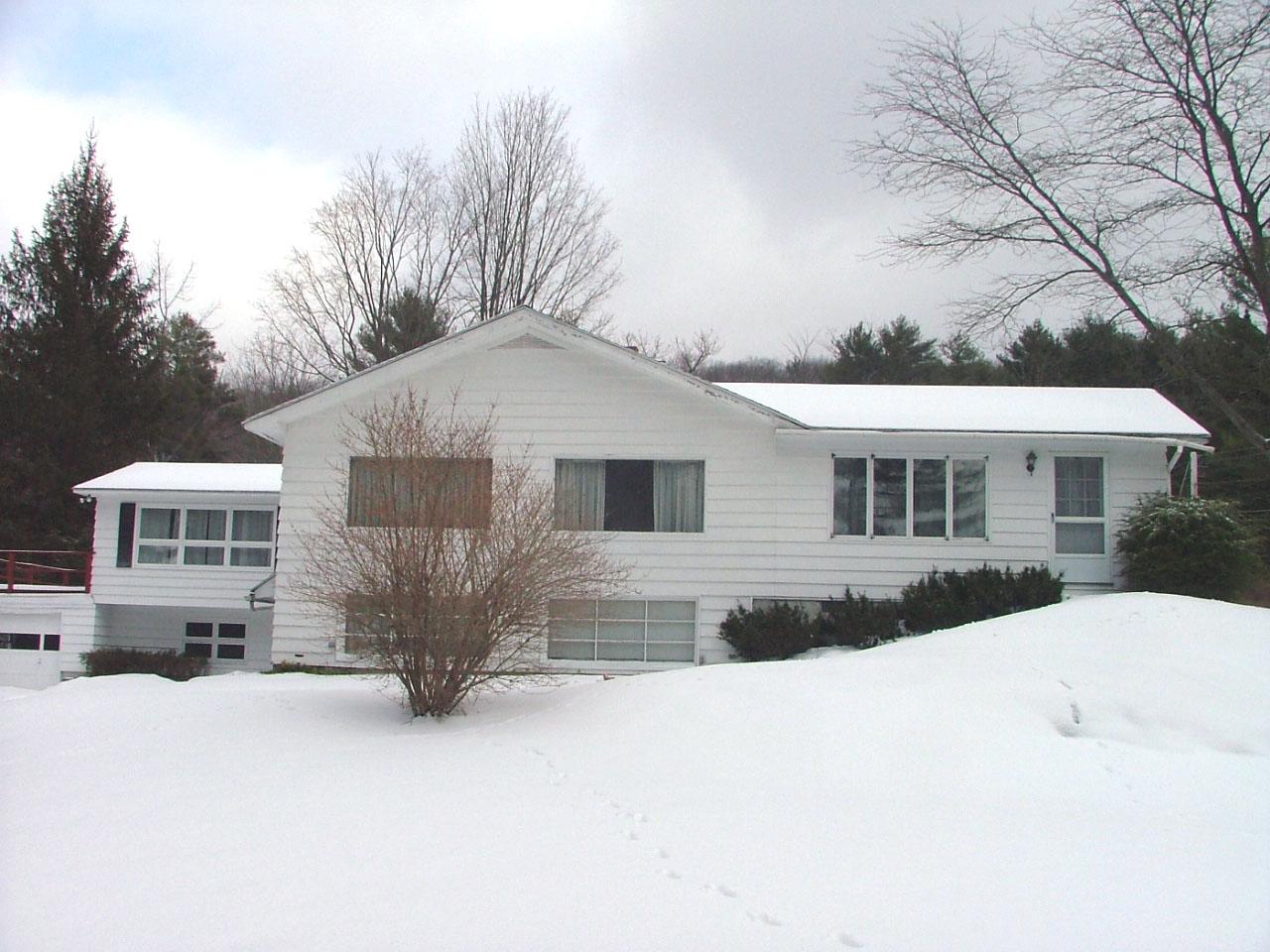 19 Interlaken Cross Road Stockbridge, MA 01262 - Photo 1 of 10 a front view of house with yard covered in snow