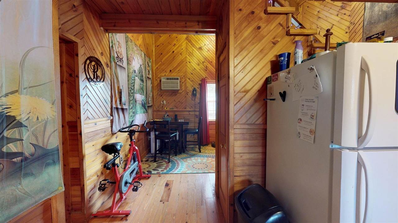 560 Reynolds Bridge Road Ocoee, TN 37361 - Photo 14 of 32 a view of walk in closet with clothes and shoes