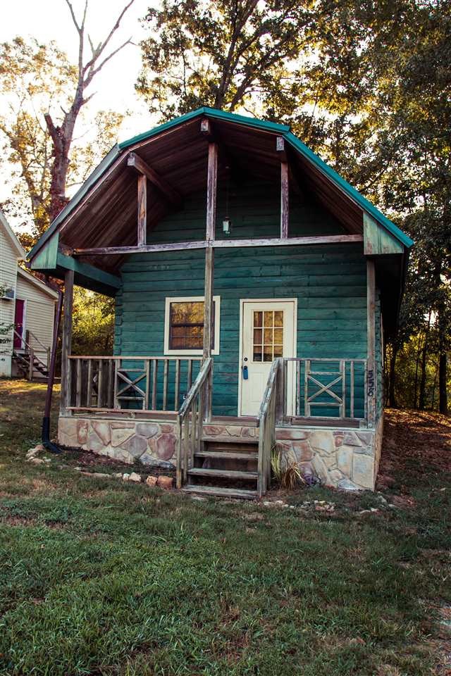 560 Reynolds Bridge Road Ocoee, TN 37361 - Photo 21 of 32 a front view of a house with garden