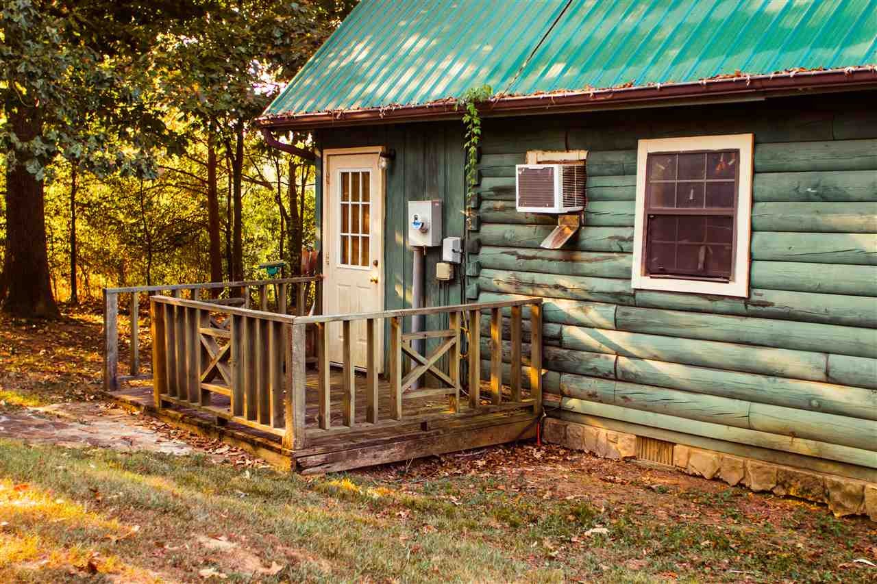 560 Reynolds Bridge Road Ocoee, TN 37361 - Photo 23 of 32 a view of a house with a wooden deck