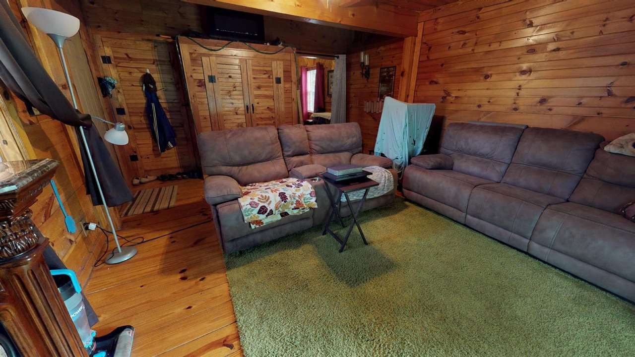 560 Reynolds Bridge Road Ocoee, TN 37361 - Photo 9 of 32 a living room with furniture and a rug