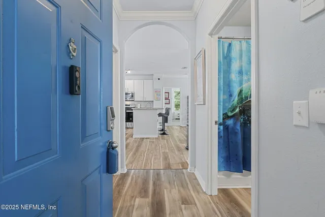 a view of a kitchen from the hallway