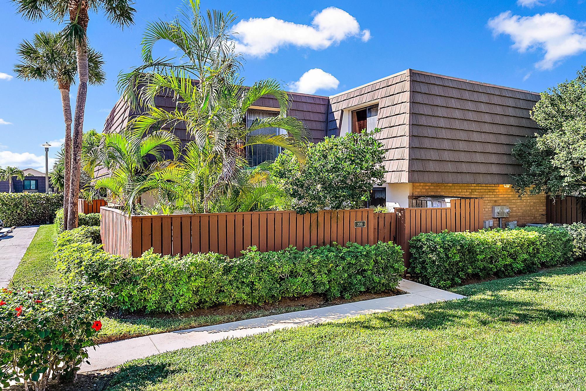 a view of a flower in front of a house