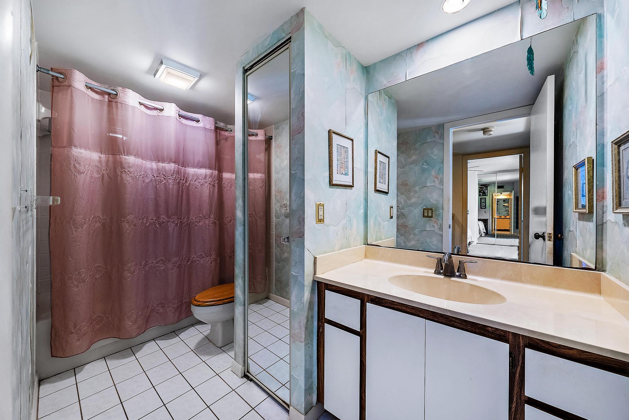 2018 20th Court Jupiter, FL 33477 - Photo 15 of 24 a bathroom with a sink and a mirror