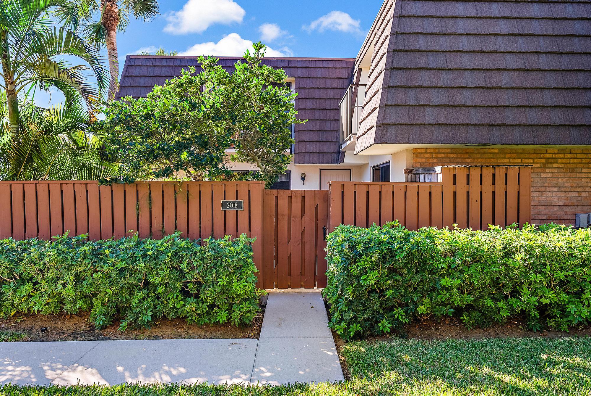 2018 20th Court Jupiter, FL 33477 - Photo 5 of 24 a view of a backyard with plants