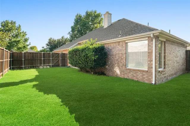 a view of a backyard with a small cabin