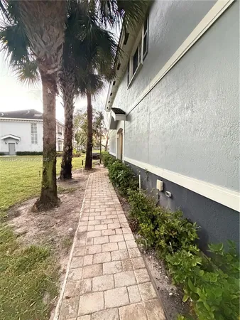 a view of a pathway with a yard