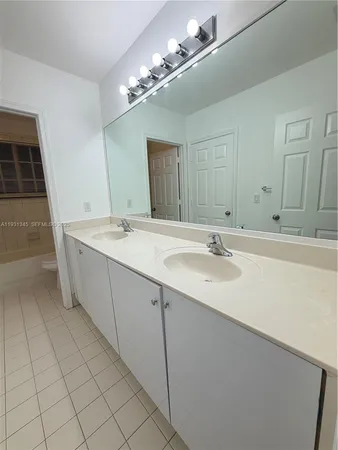 a bathroom with a toilet and a bathtub