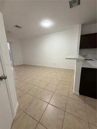 a view of a livingroom with kitchen