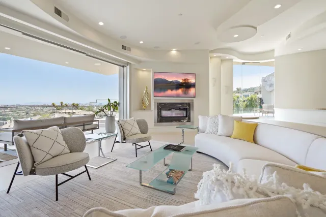 a living room with furniture and a large window