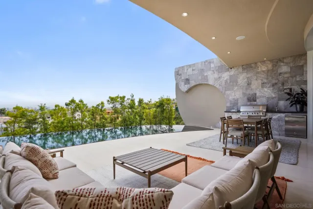 a outdoor living space with furniture and a potted plant