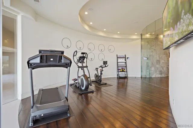 a view of a room with lots of potted plants