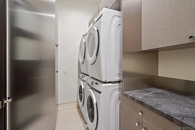 a kitchen with a sink and a large mirror