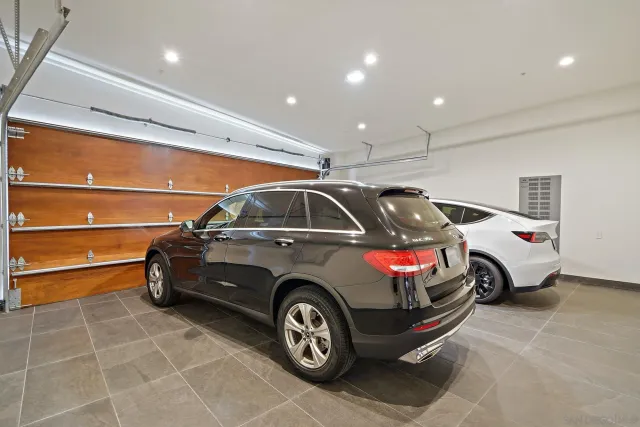 a living room with furniture a clock and a large window