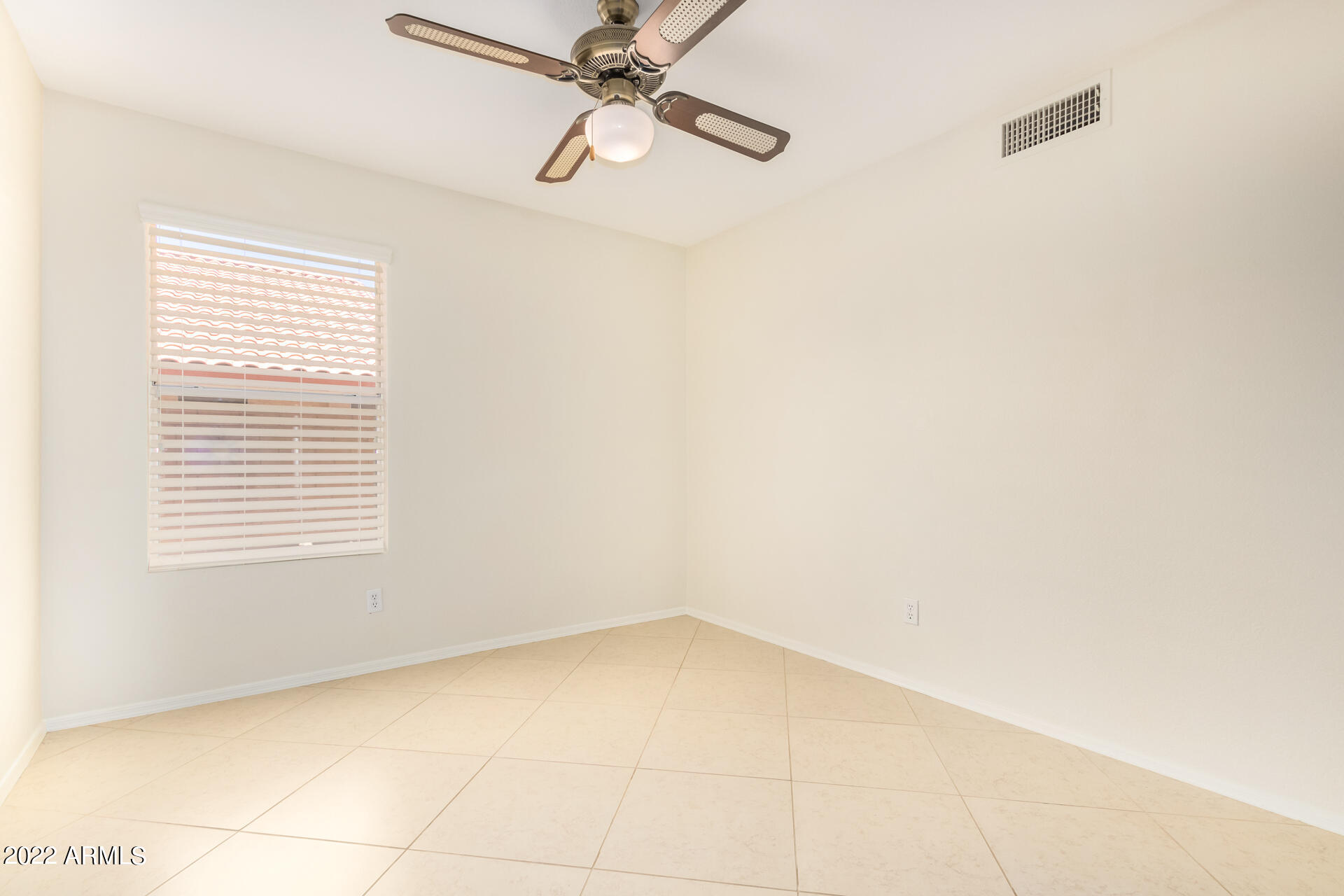 9924 West Burnett Road Peoria, AZ 85382 - Photo 16 of 24 a view of an empty room with a window