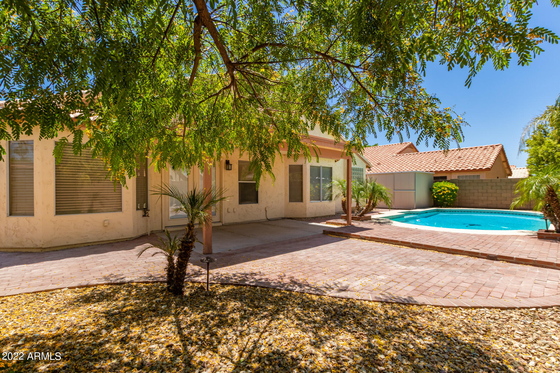 9924 West Burnett Road Peoria, AZ 85382 - Photo 24 of 24 a house with trees in front of it