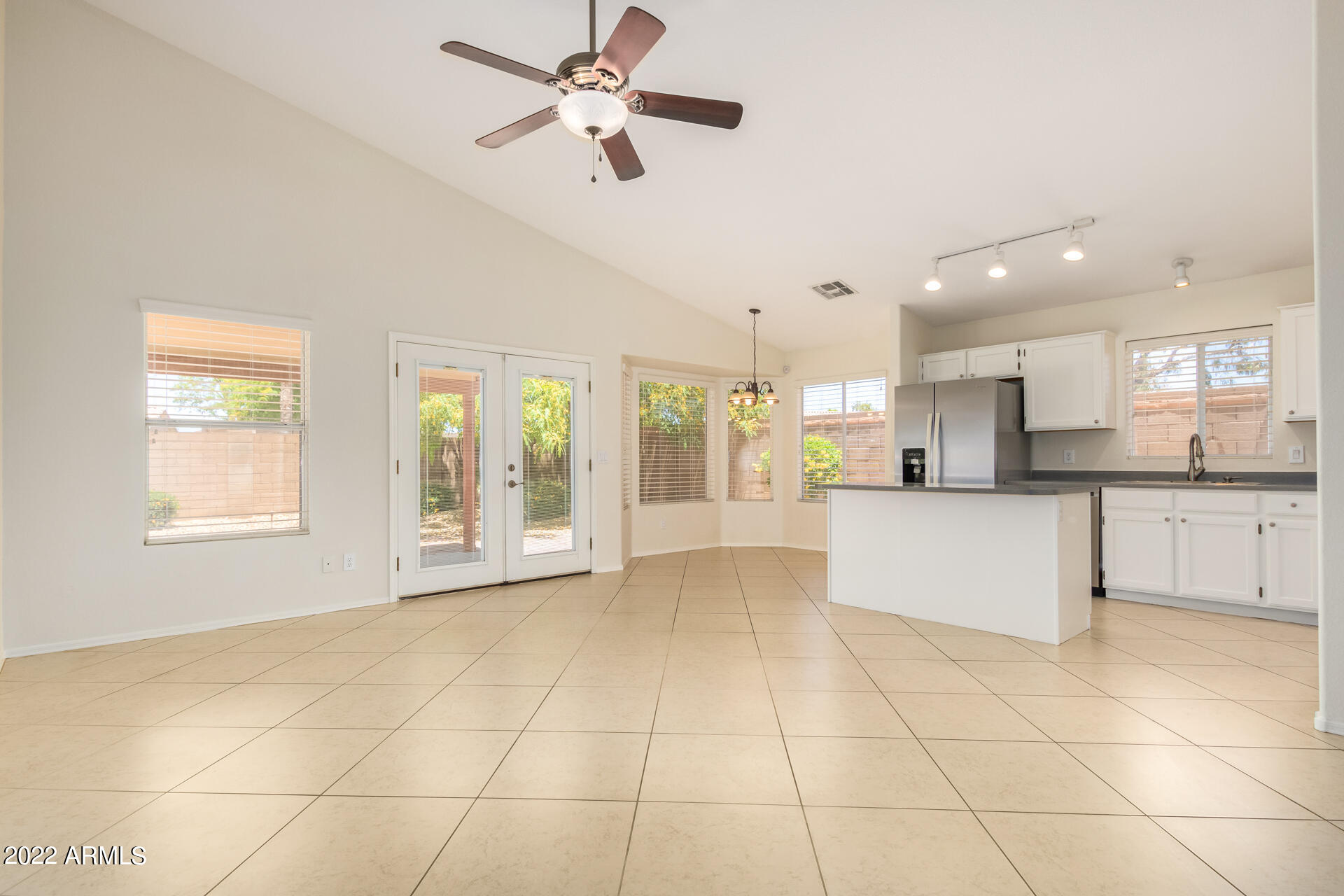 9924 West Burnett Road Peoria, AZ 85382 - Photo 8 of 24 a view of an empty room with kitchen appliances and a living room