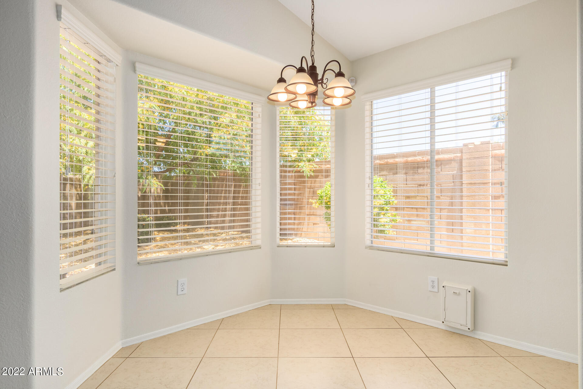 9924 West Burnett Road Peoria, AZ 85382 - Photo 9 of 24 a view of an empty room with a window