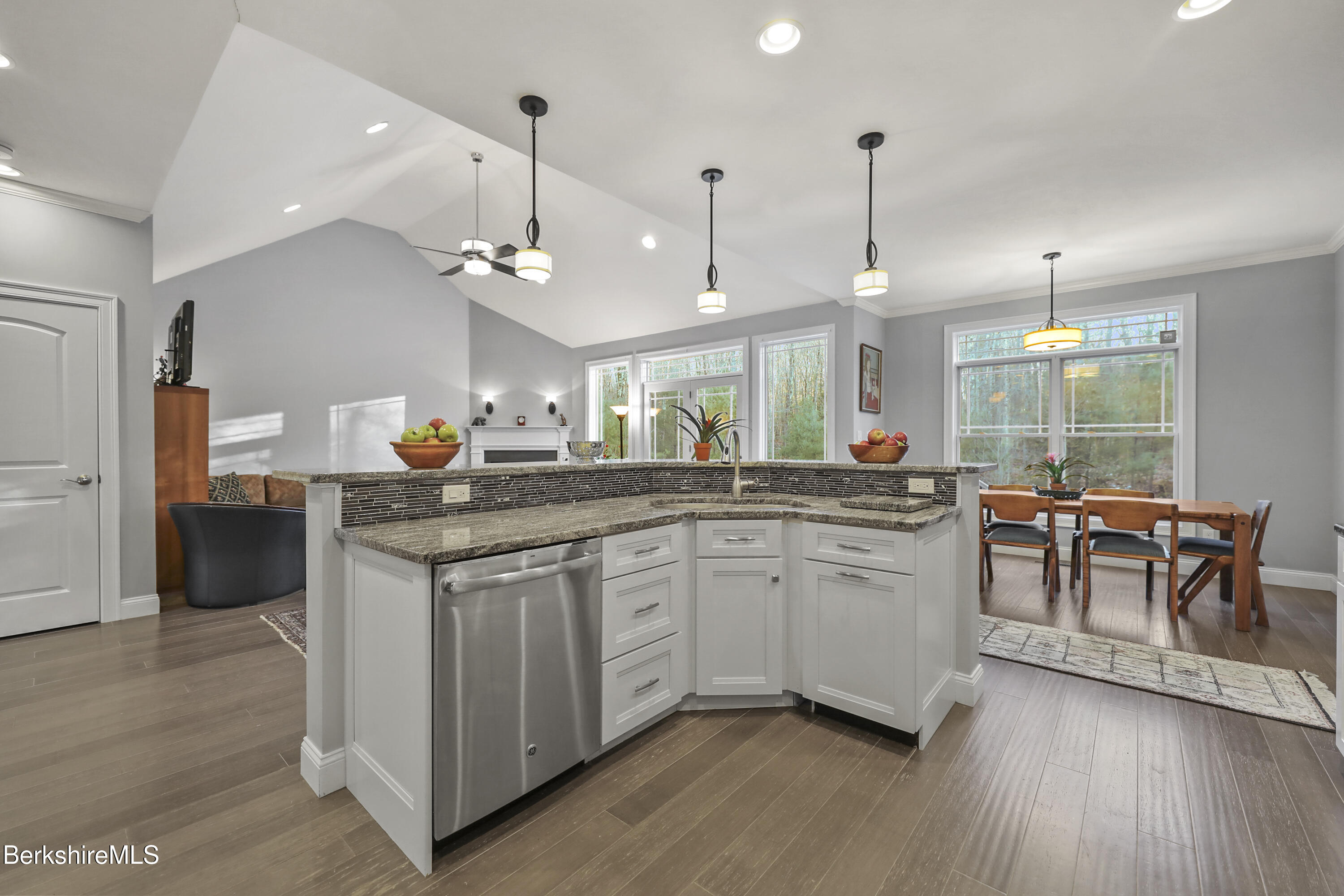 2012 East Otis Road Otis, MA 01029 - Photo 12 of 53 a kitchen with stainless steel appliances granite countertop wooden floors and white cabinets