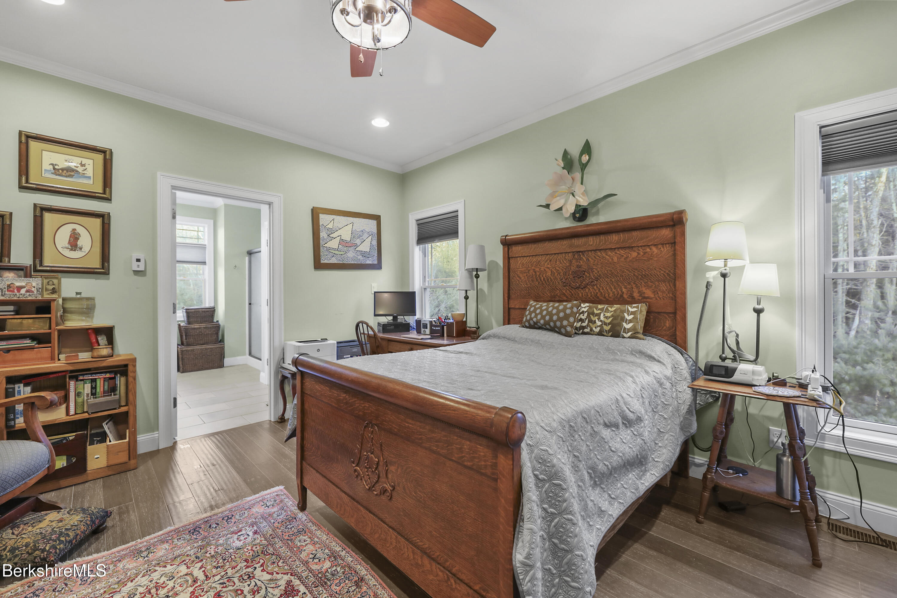 2012 East Otis Road Otis, MA 01029 - Photo 15 of 53 a bedroom with a bed and a chandelier
