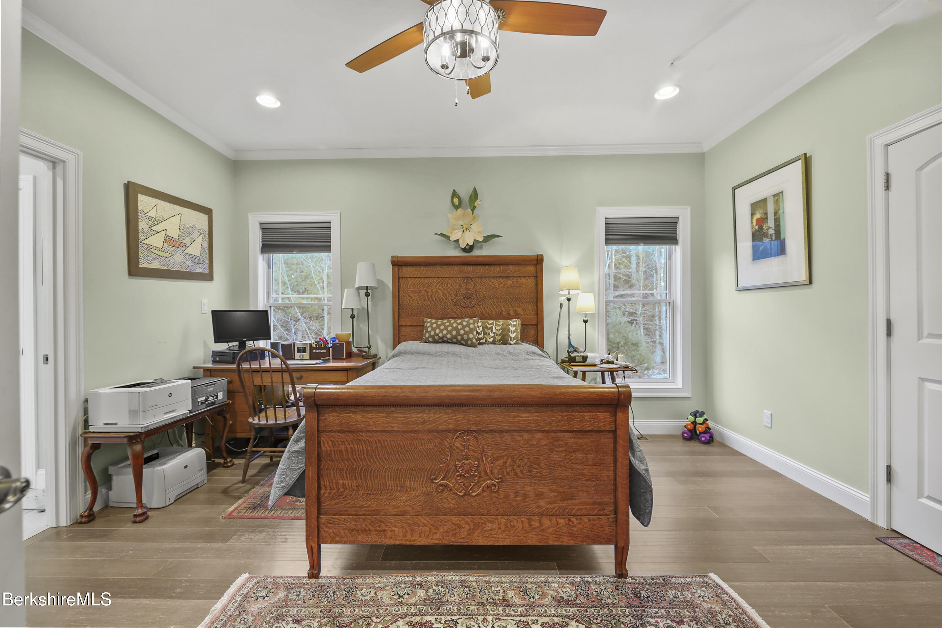 2012 East Otis Road Otis, MA 01029 - Photo 16 of 53 a bedroom with a bed and a chandelier